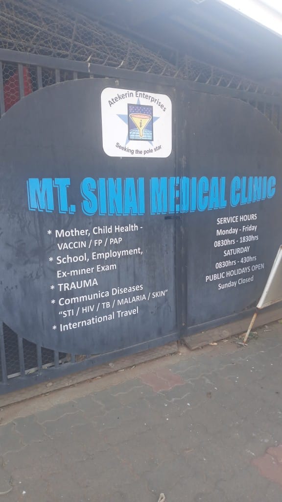 MT. Sinai Medical Clinic gate with services listed
